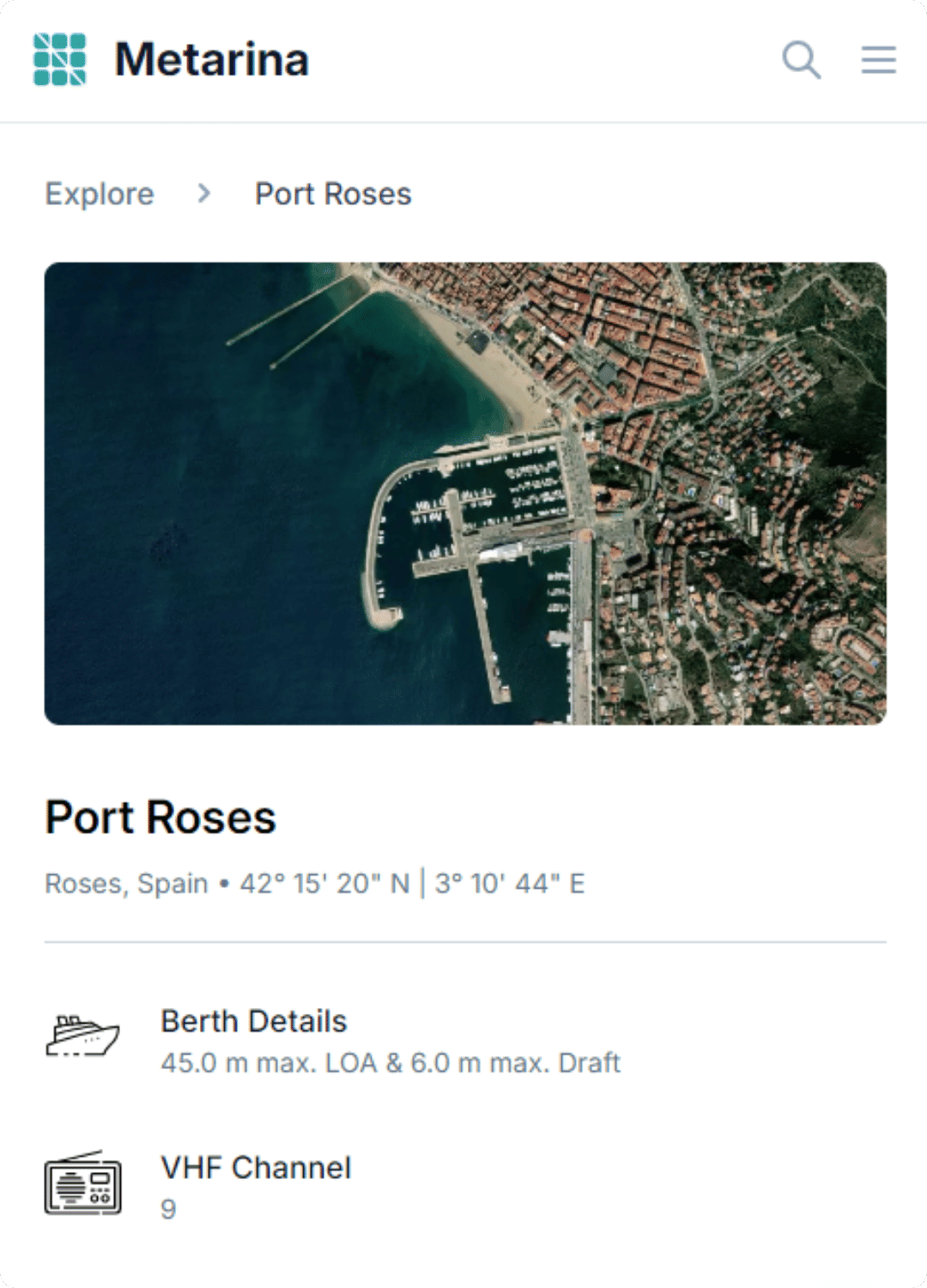 Aerial view of Port Adriano marina, showing the marina layout and surrounding coastline